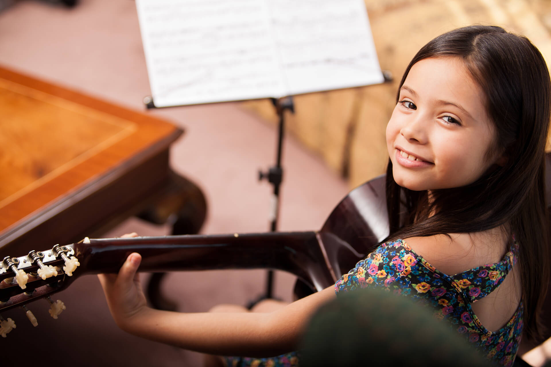 Girl in Suzuki guitar lesson