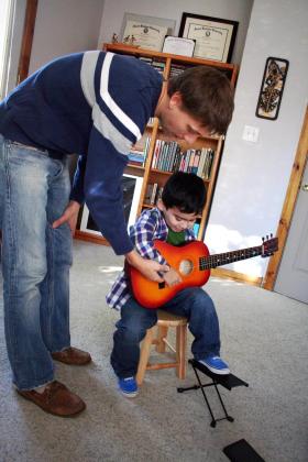 boy in suzuki guitar lesson in Richmond VA