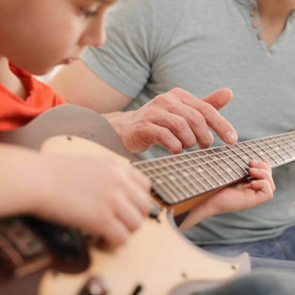Guitar student taking Suzuki lessons