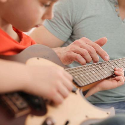 kid in Suzuki guitar lesson in Richmond VA